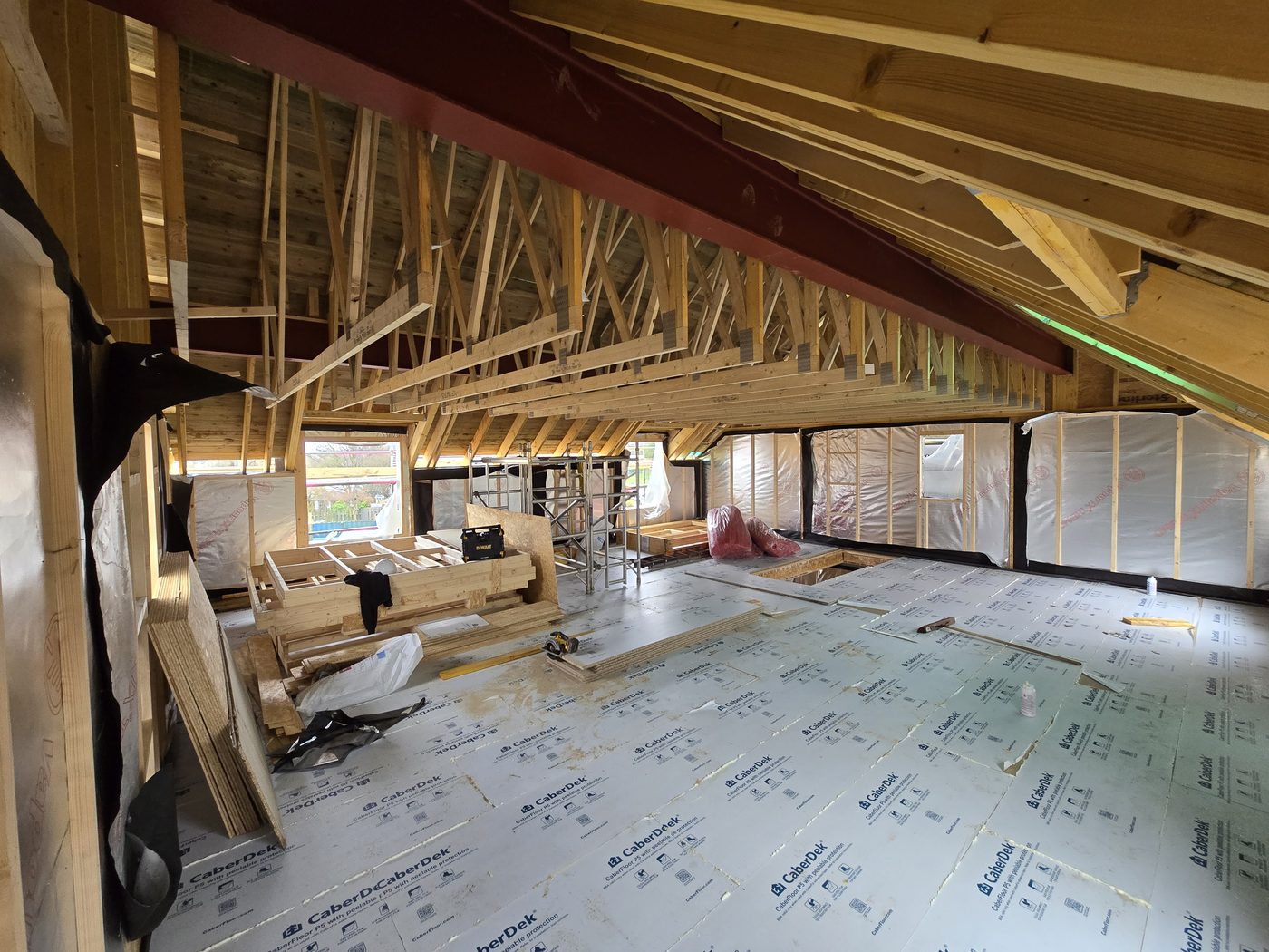 Upper floor of a self build with trusses and steel beam